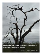 vultures sitting in a bare tree against a dark, cloudy sky
