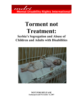 an emaciated young child restrained in its crib